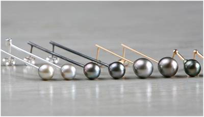 Earrings in18k gold and silver with cultured tahiti pearls and diamonds