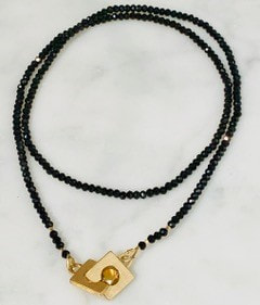Black spinels with an 18k gold clasp