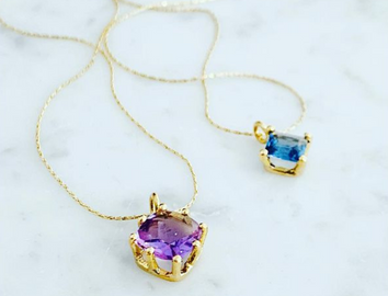 Necklaces in 23k gold with amethyst and topaz
